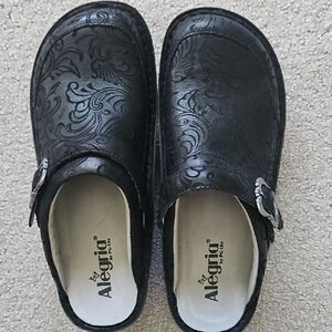 Alegria Black Embossed Floral Clogs with Decorative Buckles